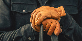 A man wearing fleece lined work gloves in the winter.