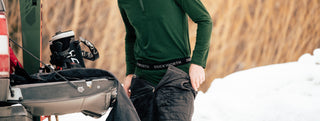 An ice skater wearing wool layers.