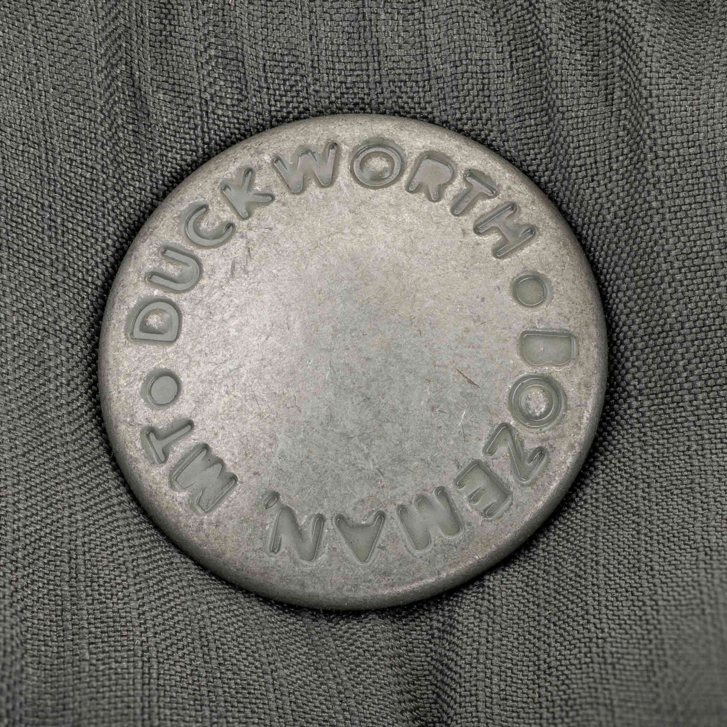 Duckworth branded snaps on a vest.