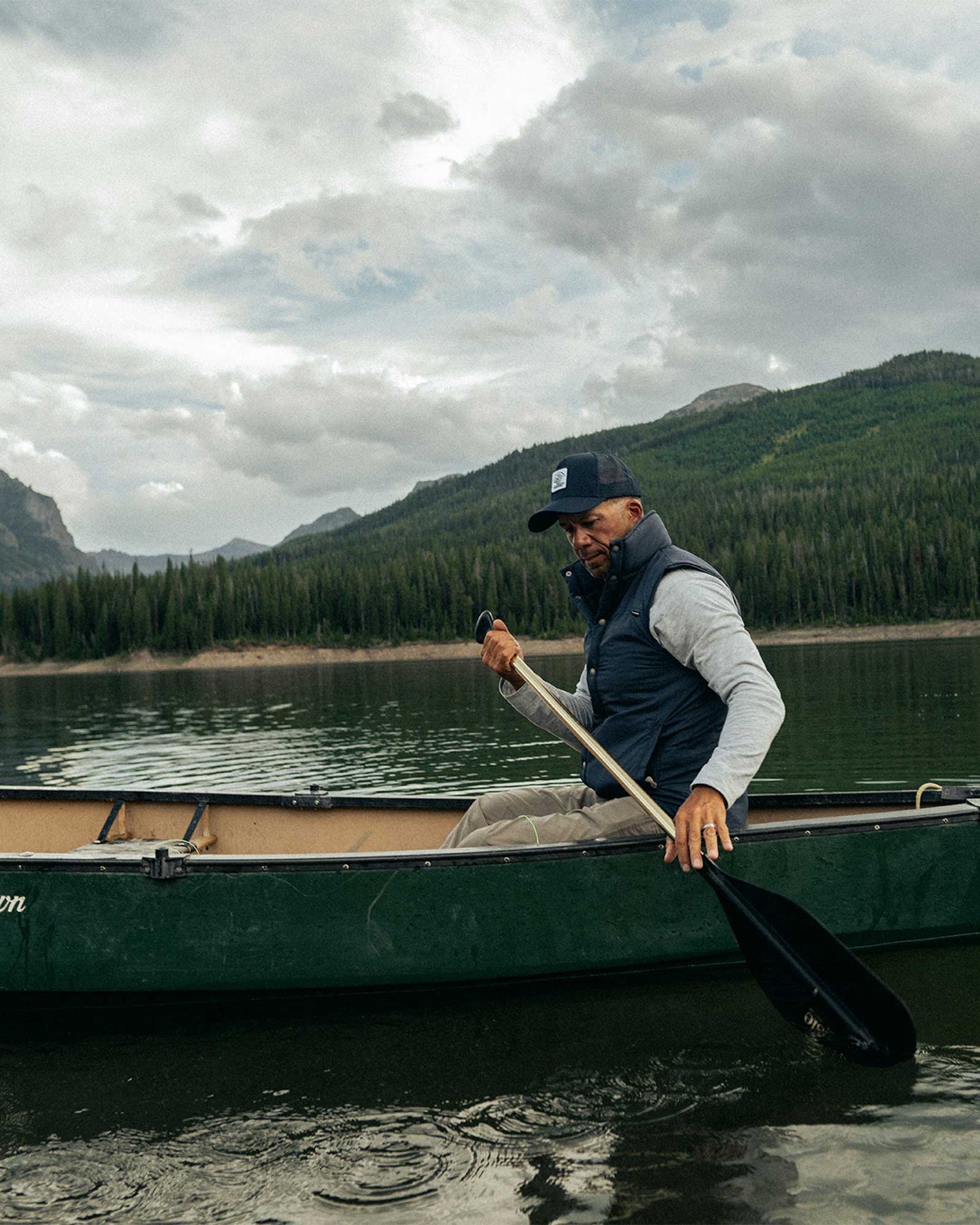 A man canoeing on a lake in Montana.