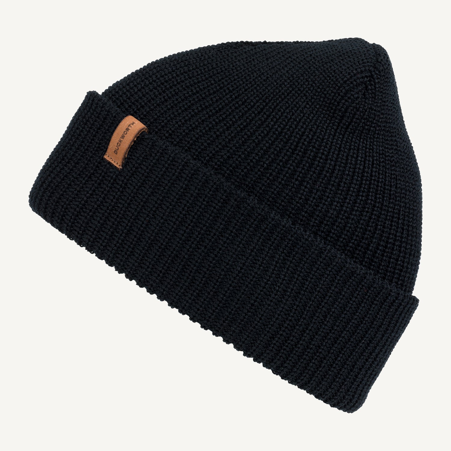 Black American made knitted merino wool hat with leather patch. 