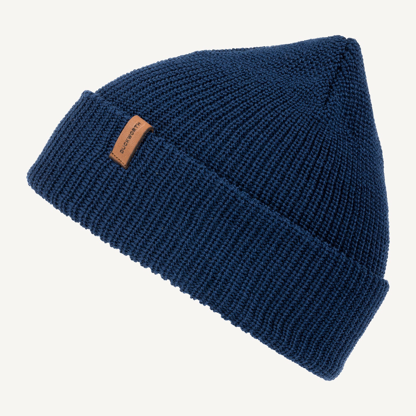 Blue American made knitted merino wool hat with leather patch. 