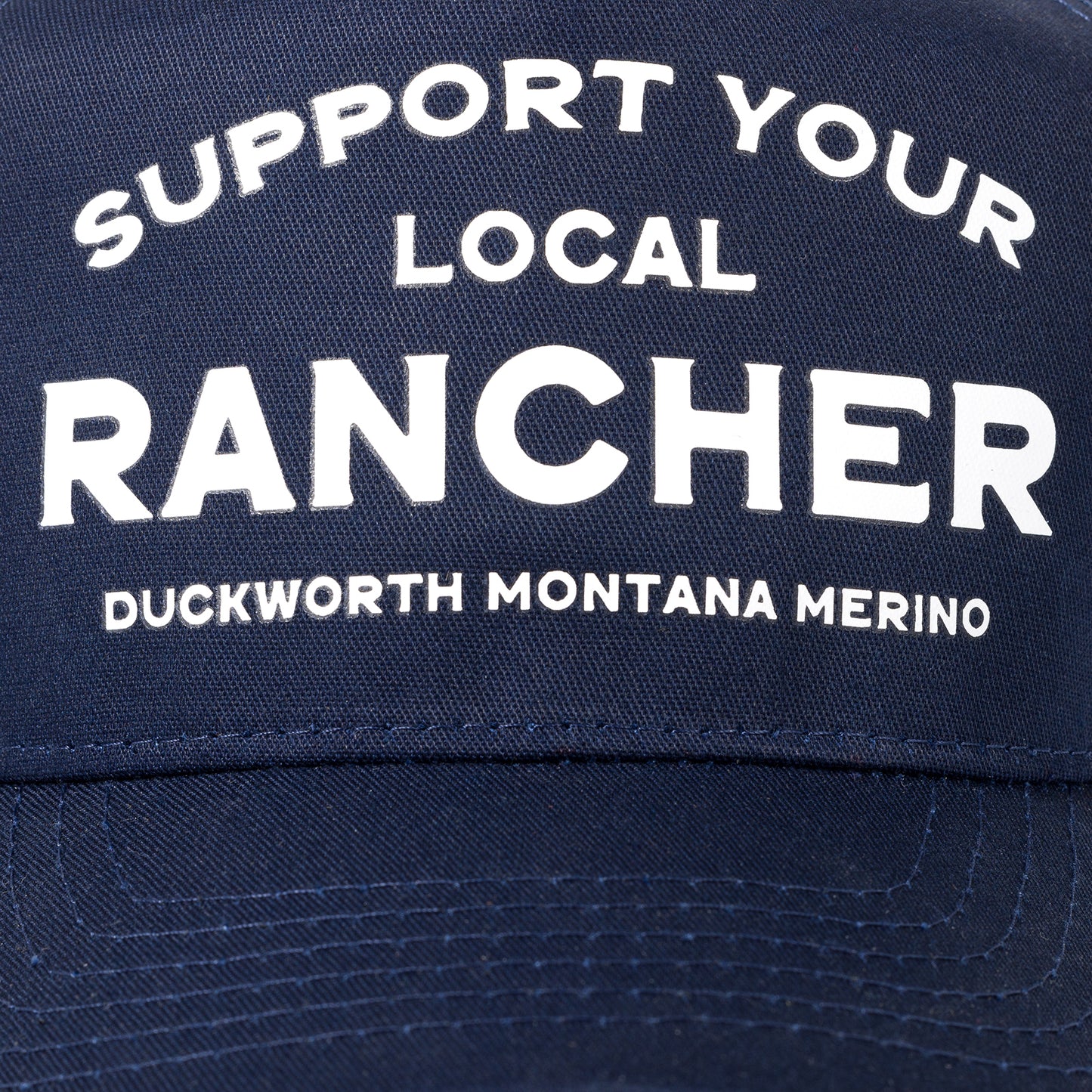 A blue American made trucker hat that supports Montana and ranching. 