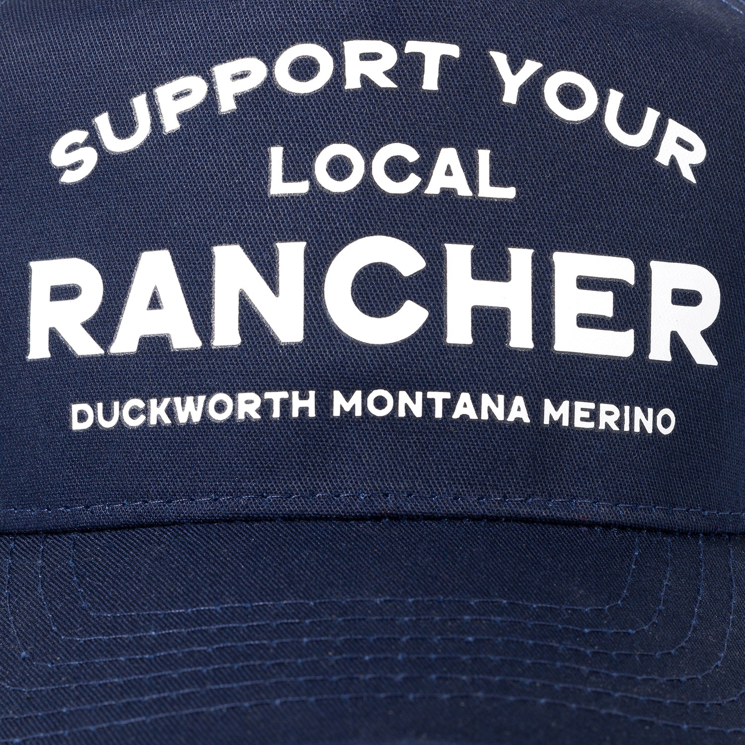 A blue American made trucker hat that supports Montana and ranching. 
