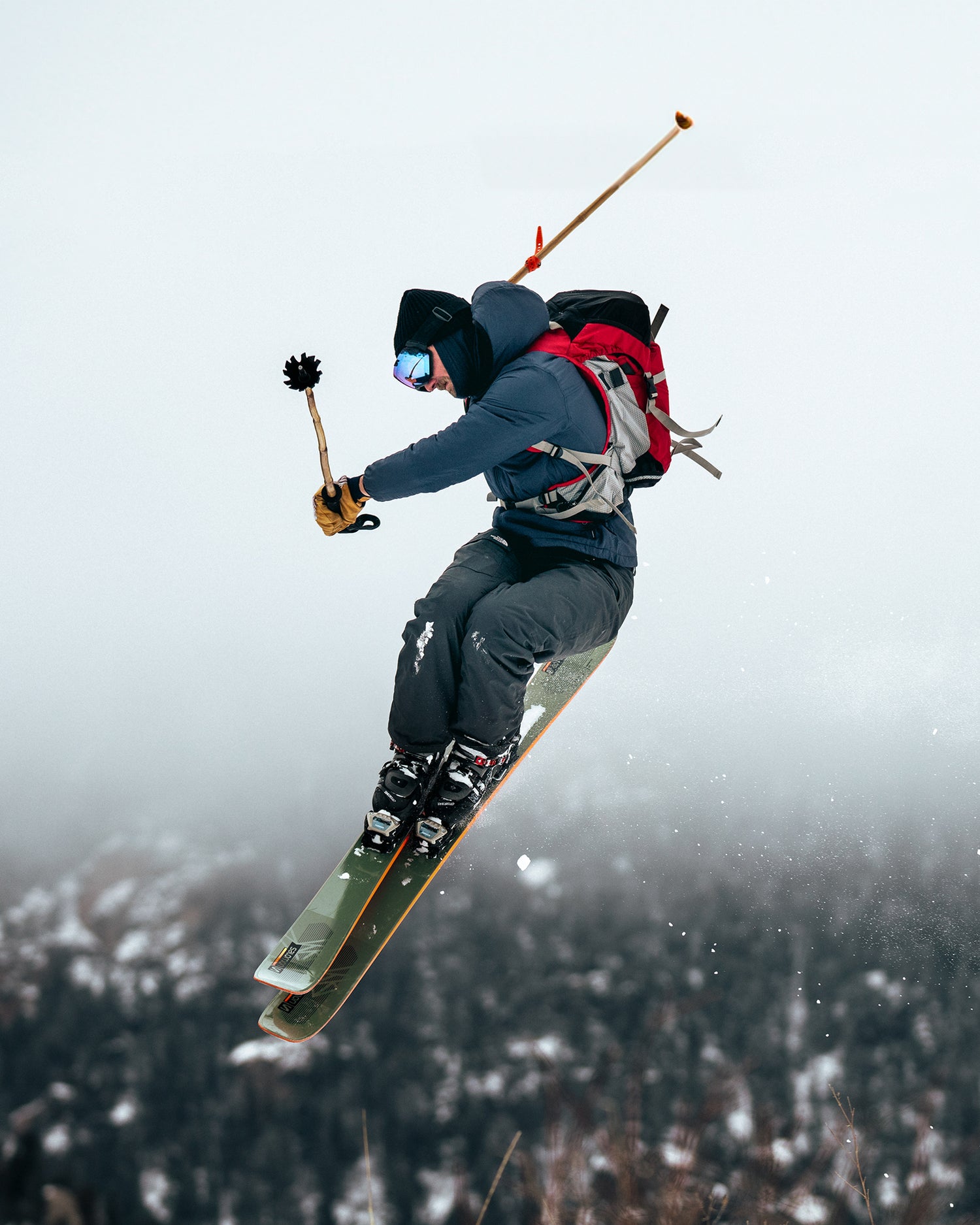 A man skiing wearing merino wool layers in Montana.