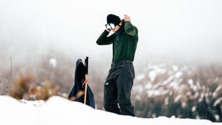 A man skiing in merino wool layers
