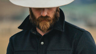 A real cowboy wearing a merino wool heritage shirt jacket.