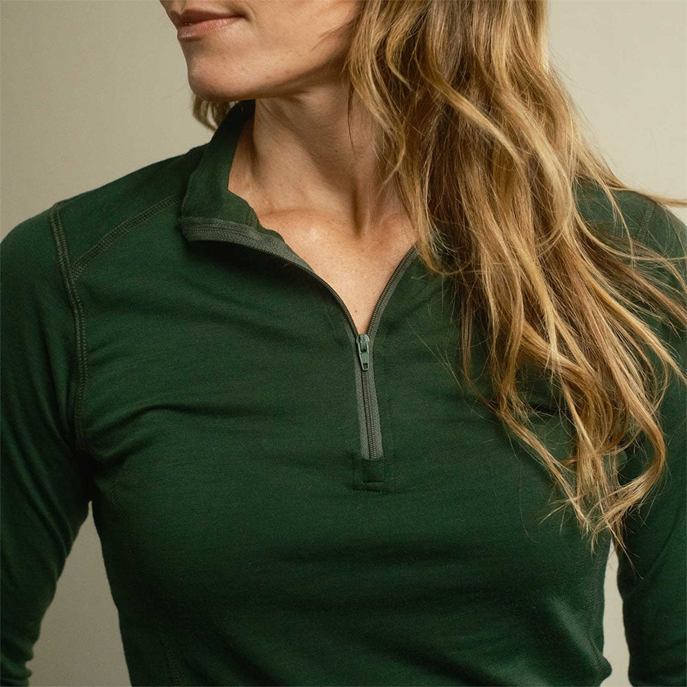 A green American made Duckworth merino wool quarter zip base layer.